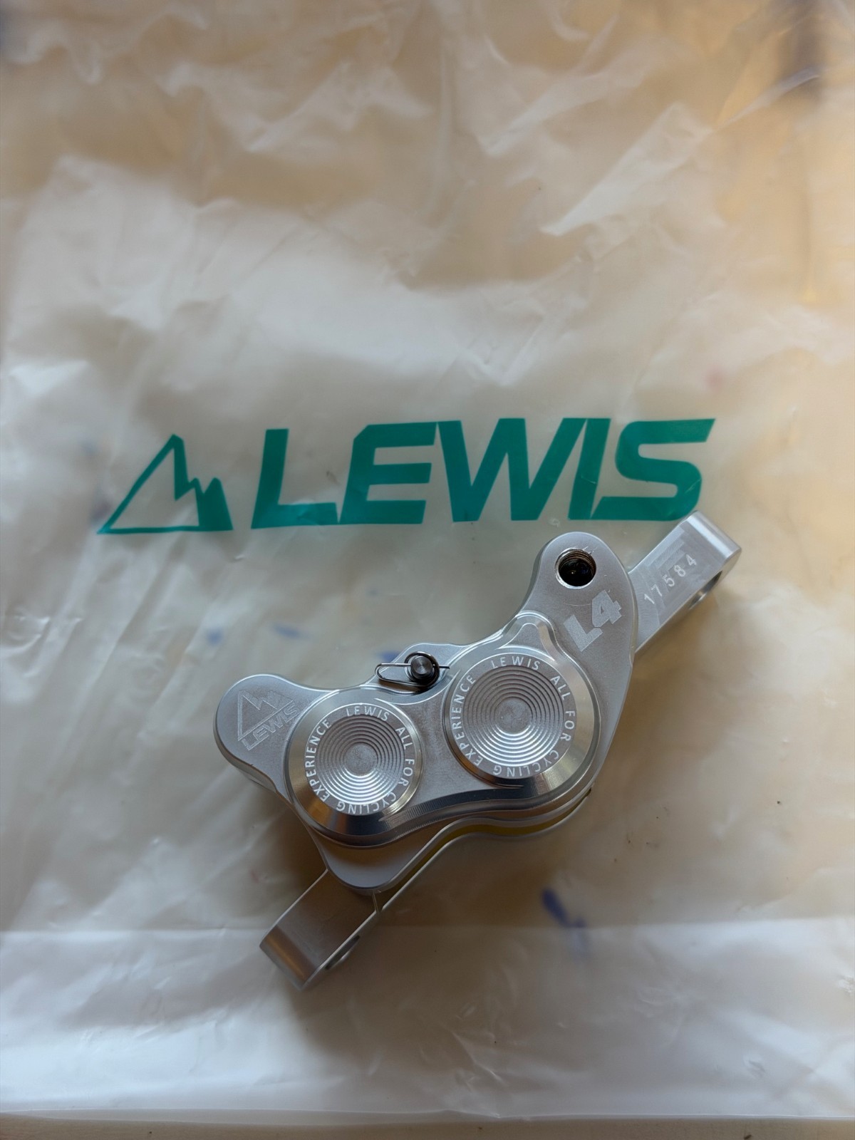 Lewis LH4 4-piston caliper, SILVER, NEW. Includes new pads.