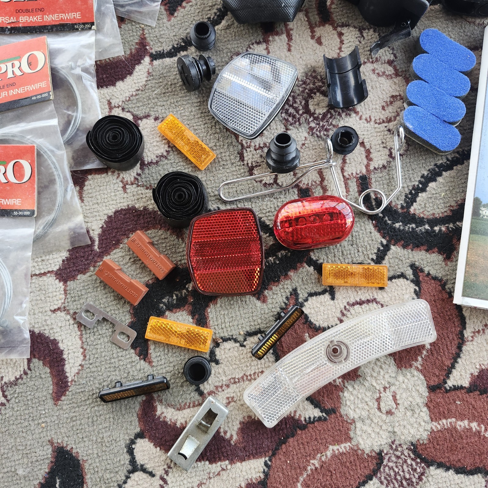 Lot of bicycle Supplies repairs pump pedals straps maps, reflectors, helmet pads