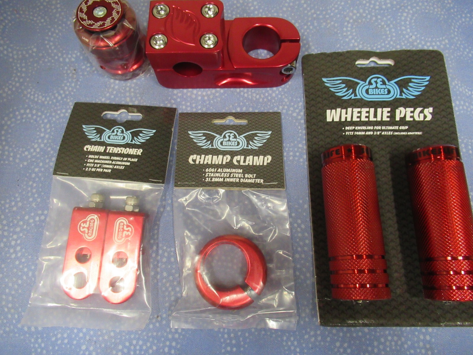 SE Bikes BMX Mix Lot-Pegs, Narler, Eluder Headset, Champ Clamp, Tensioner-Red