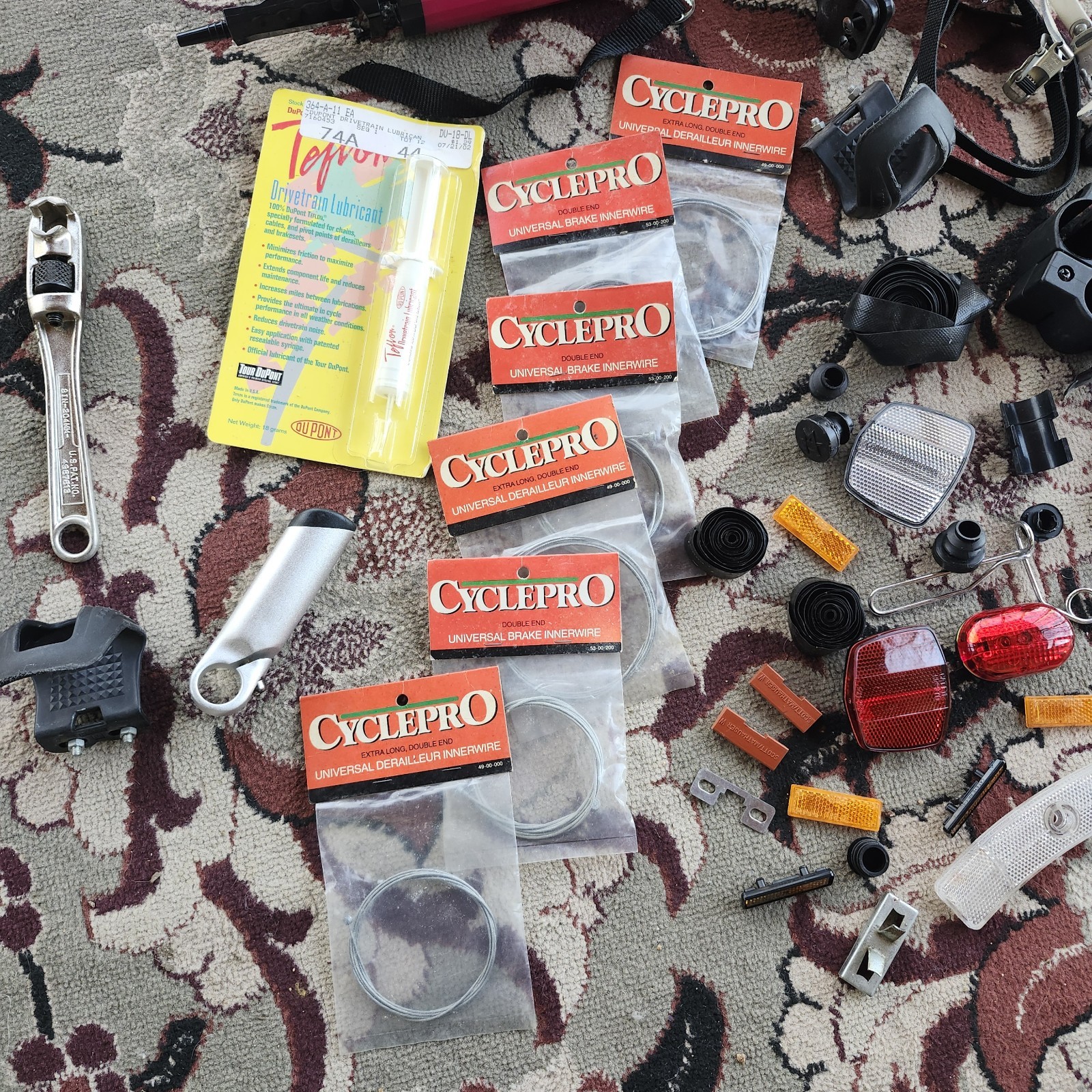 Lot of bicycle Supplies repairs pump pedals straps maps, reflectors, helmet pads