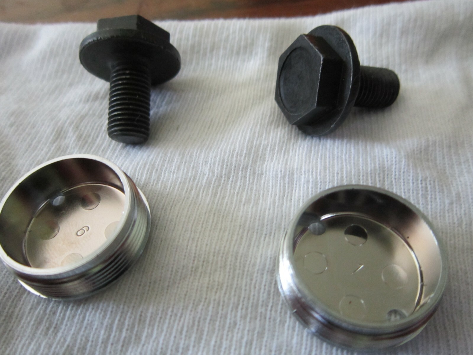 2 Shimano crank arm bolts and 2 crank arm caps N.O.S.