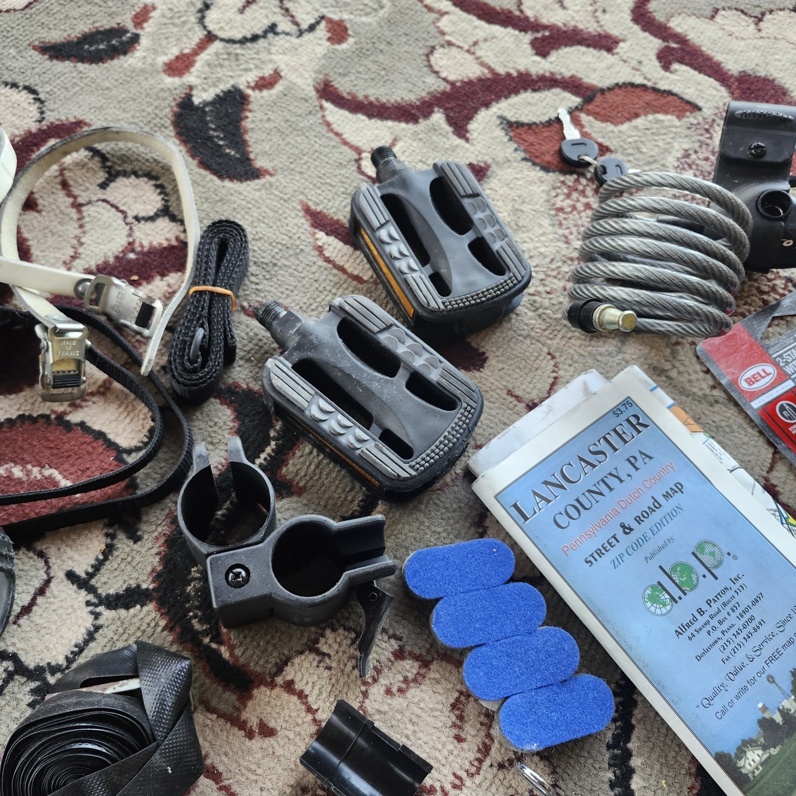 Lot of bicycle Supplies repairs pump pedals straps maps, reflectors, helmet pads