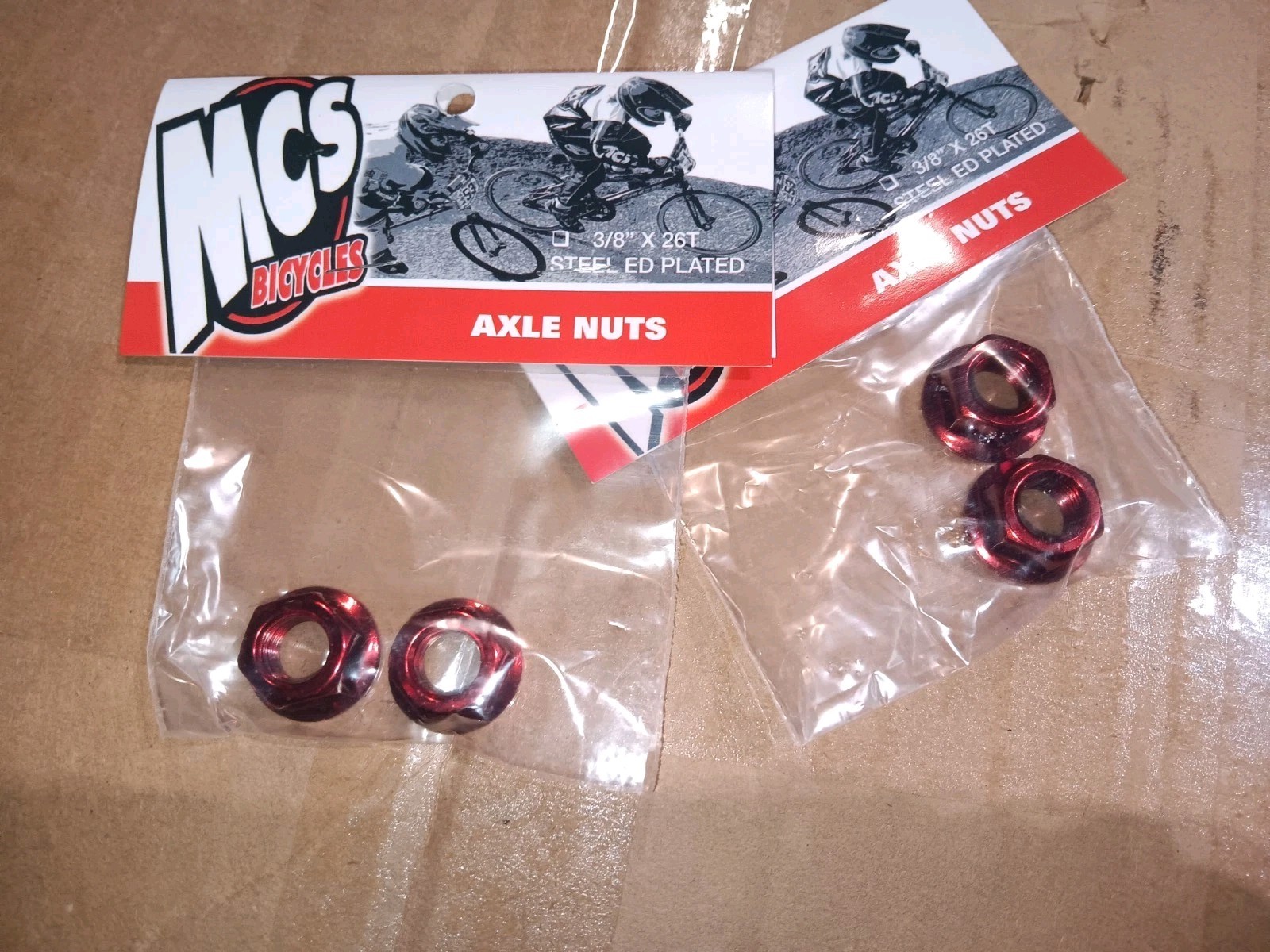 MCS Red Chromoly Flanged Axle Nuts 3/8″x26t Set of 4