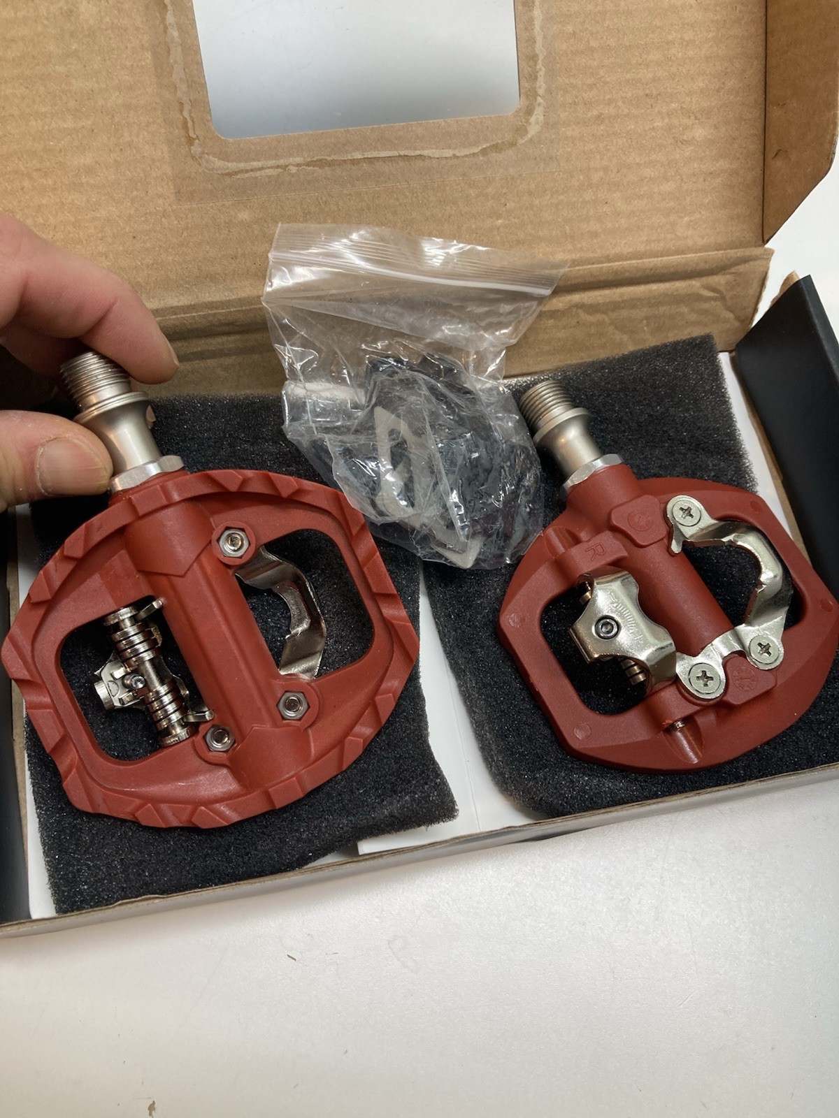 Red dual-sided clipless or flat platform mountain bike pedals fits Shimano SPD