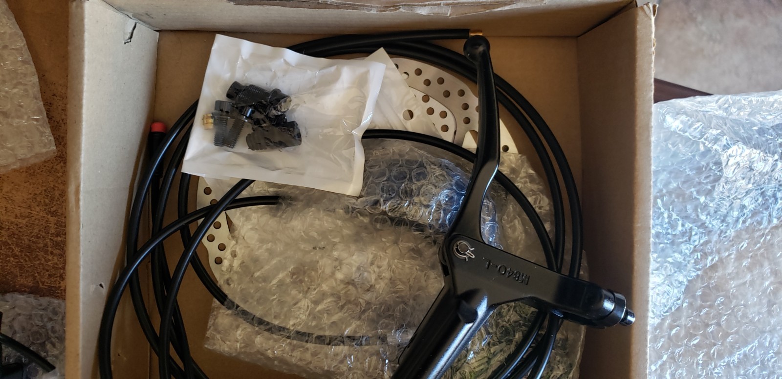 ZTZ eBIKE HYDRAULIC BRAKE SET IN AN OPEN BOX