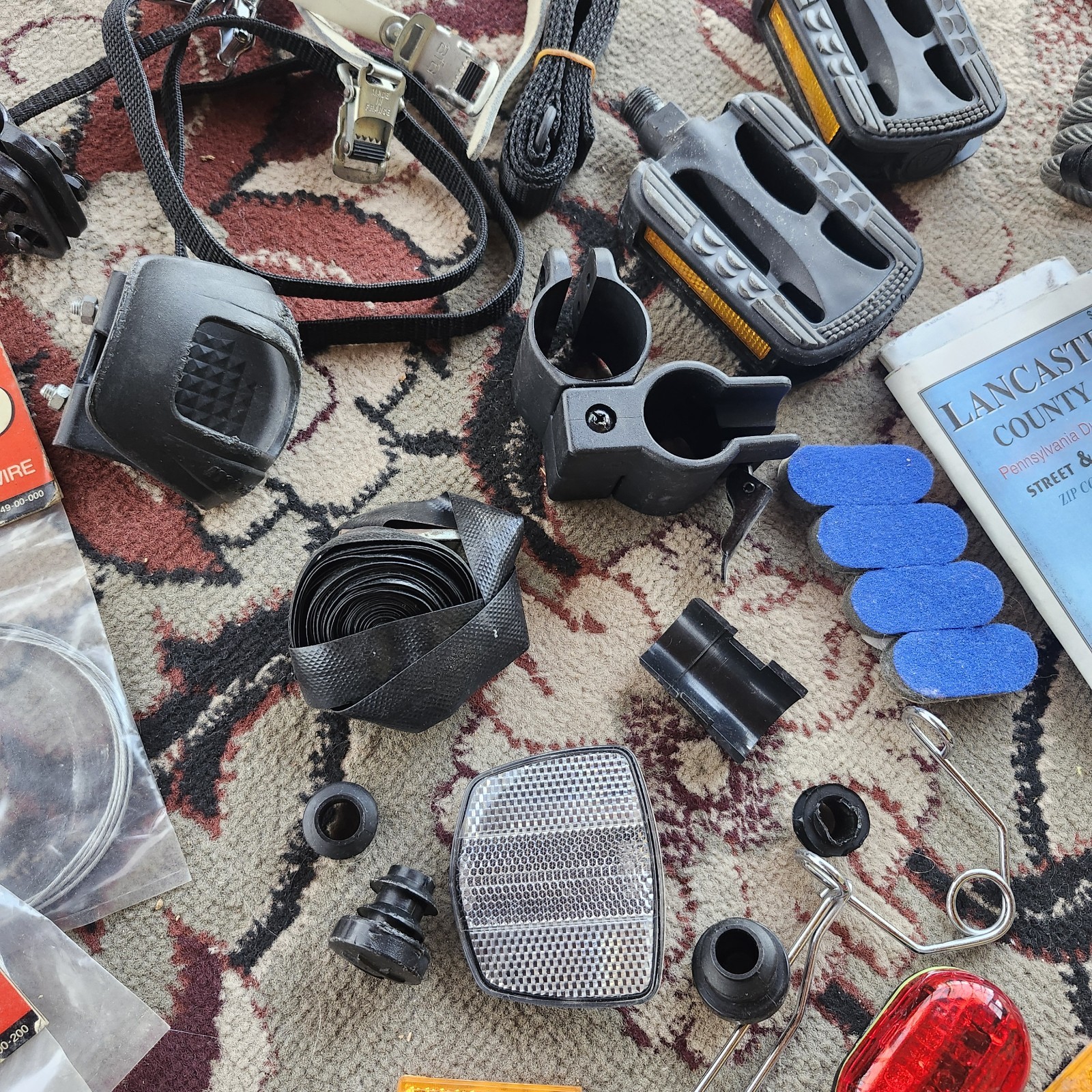 Lot of bicycle Supplies repairs pump pedals straps maps, reflectors, helmet pads