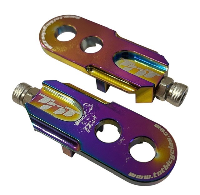 BMX – TNT BICYCLES CHAIN TENSIONERS – OIL SLICK (B-STOCK – DISCOUNTED)