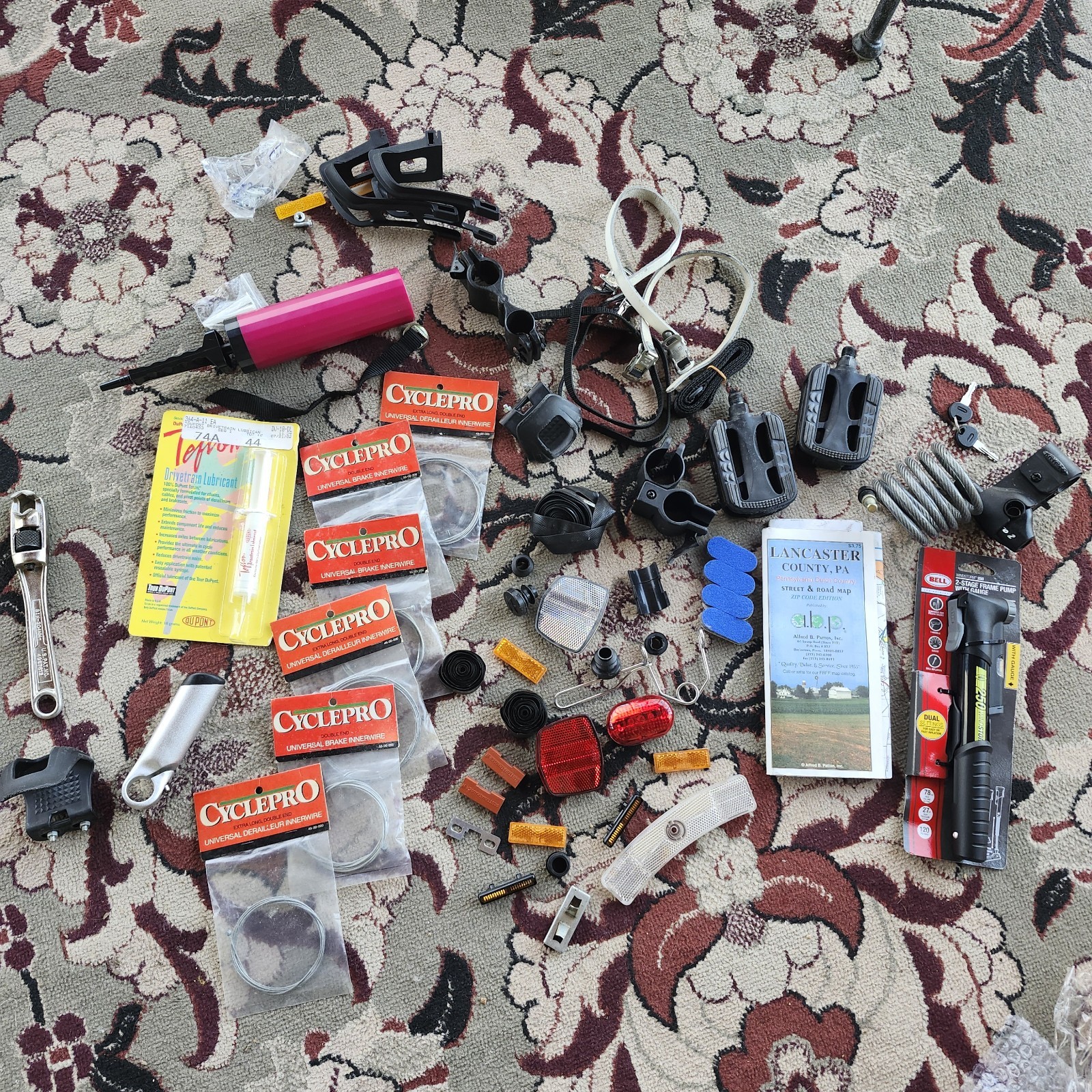 Lot of bicycle Supplies repairs pump pedals straps maps, reflectors, helmet pads