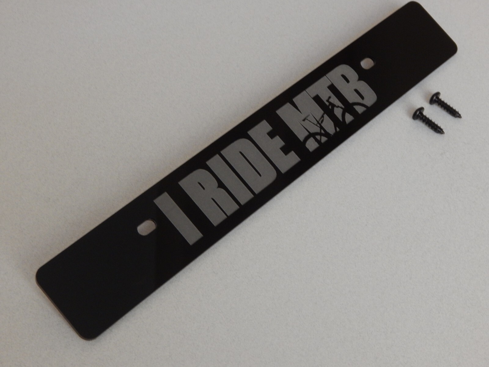 Front license plate delete black acrylic laser engraved with: I RIDE MTB
