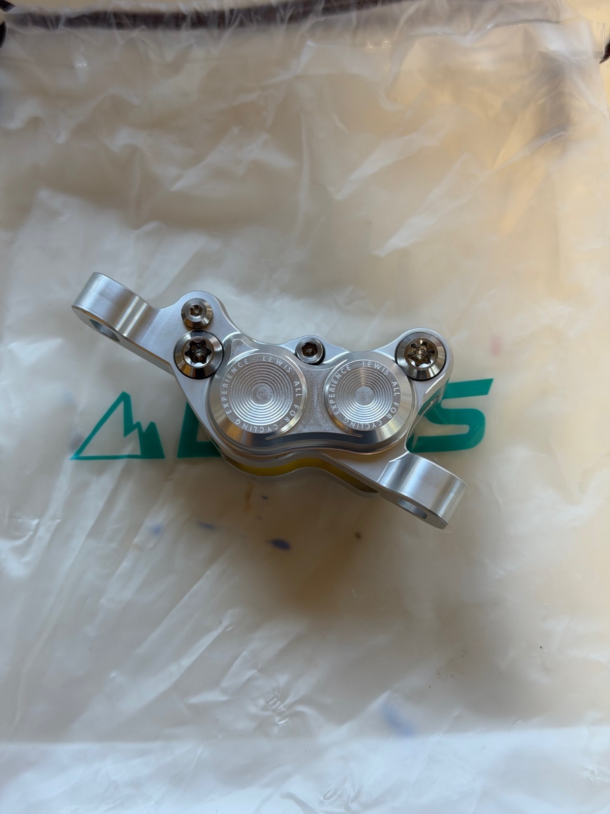 Lewis LH4 4-piston caliper, SILVER, NEW. Includes new pads.
