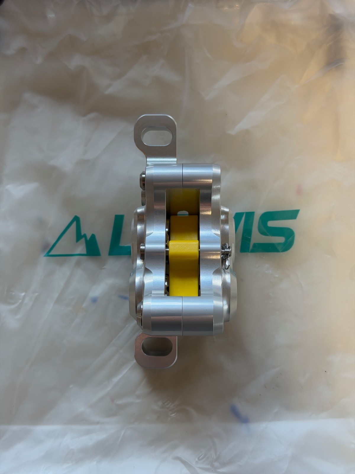 Lewis LH4 4-piston caliper, SILVER, NEW. Includes new pads.