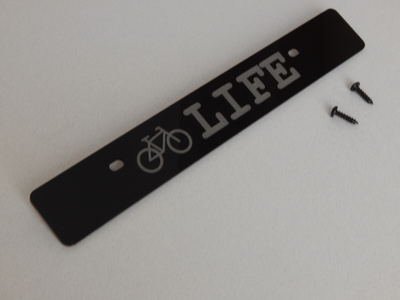 Front license plate delete black acrylic laser engraved with: (bike) LIFE