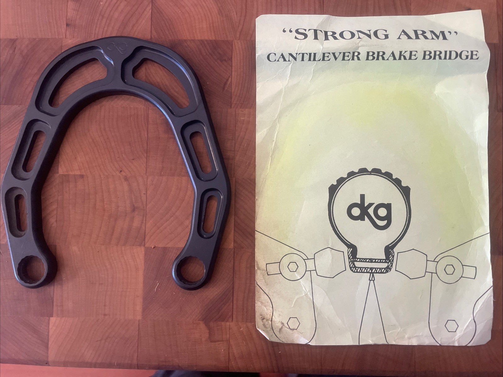 Vintage New-Old-Stock DKG «Strong Arm» Cantilever Brake Bridge • Black. (FSW)