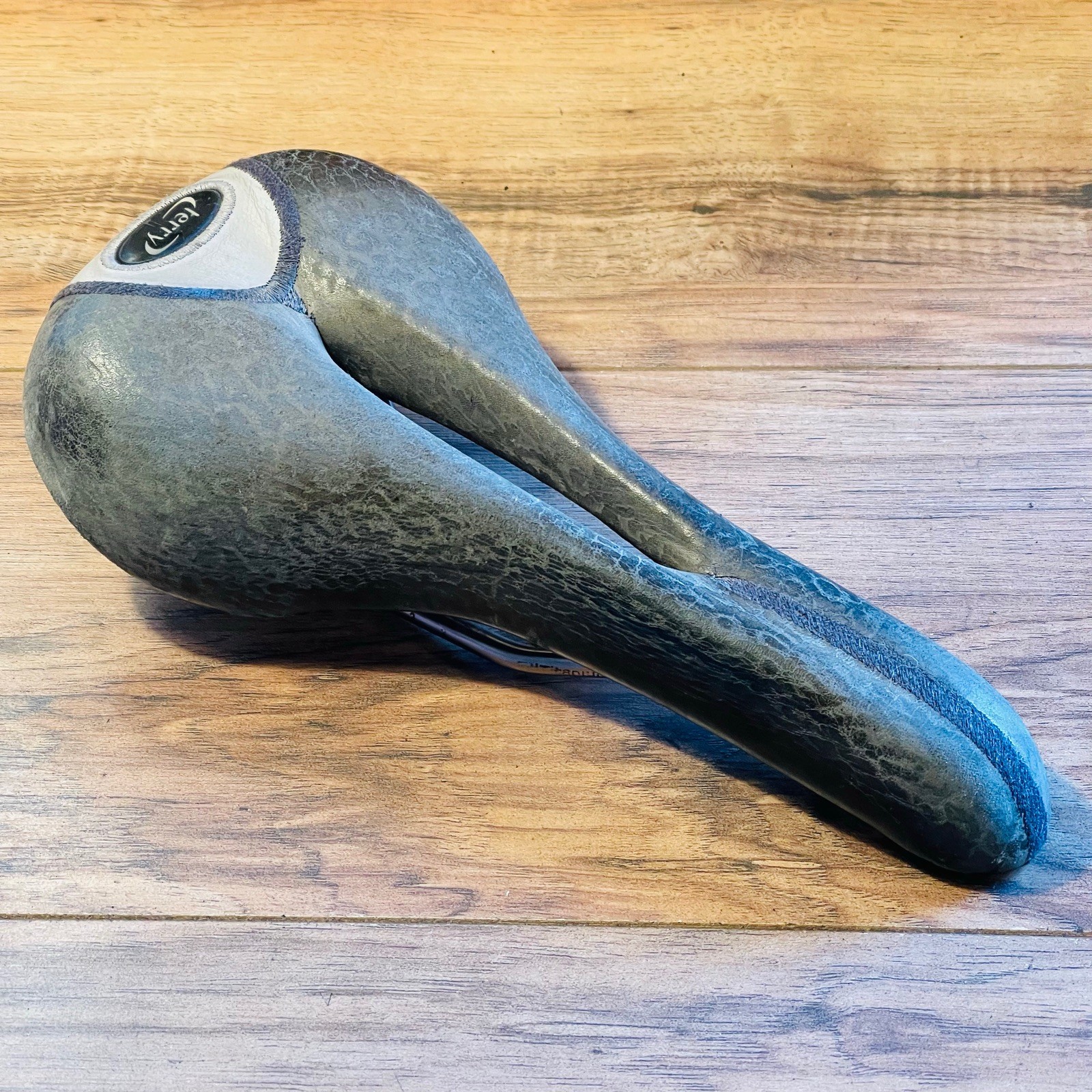 Terry  Cutaway Saddle Gray Leather Titanium Rails