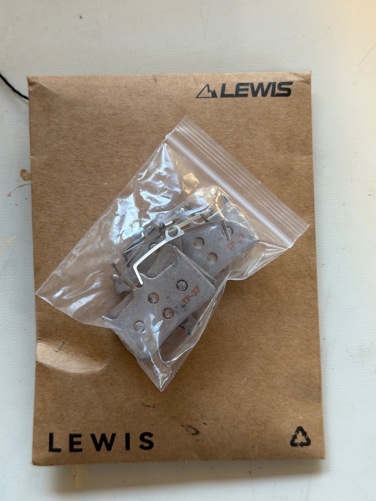 Lewis LH4 4-piston caliper, SILVER, NEW. Includes new pads.