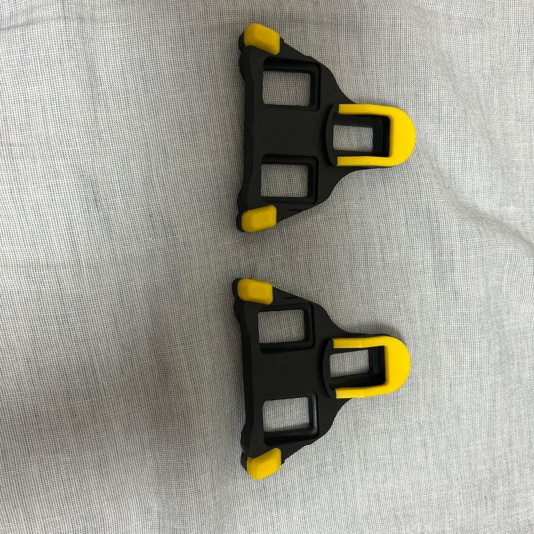 Set of 2 black and yellow cleats