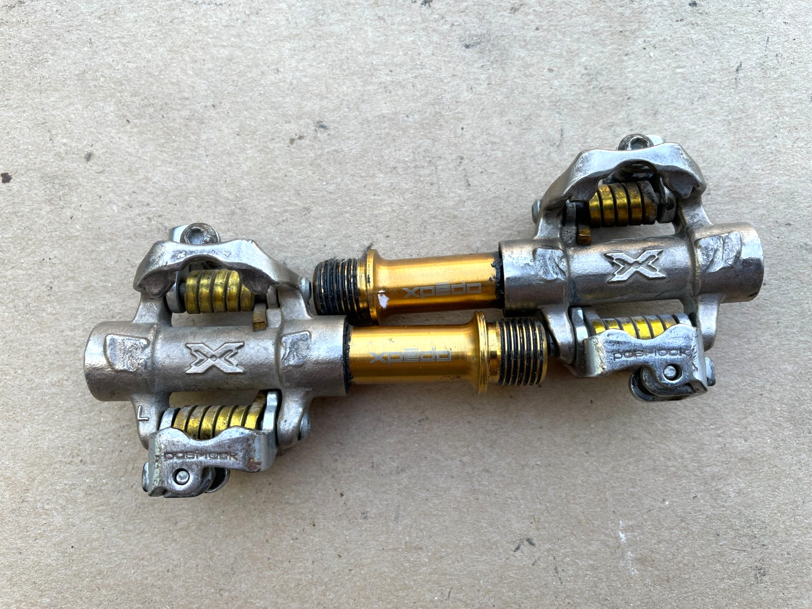 Xpedo «posi-lock» clipless pedals Silver/Gold