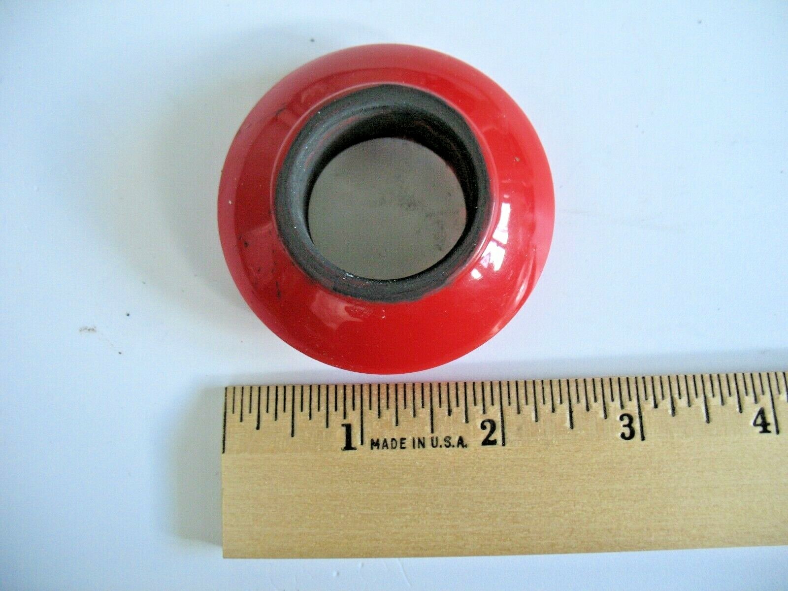 Red Bottom Head Set Cover from a Joovy Bicycoo Balance Bike